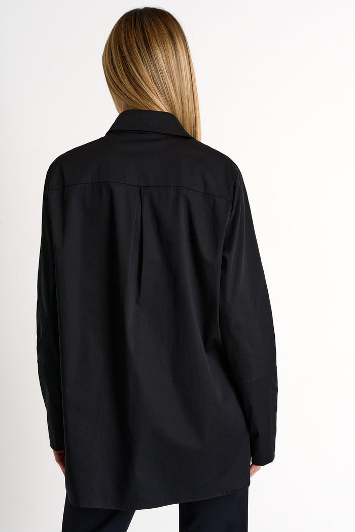 Person wearing a black shirt on a white background